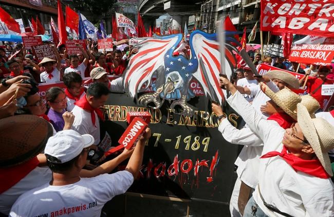 At site of 1986 revolt, Filipinos protest Marcos burial | iNFOnews.ca At site of 1986 revolt, Filipinos protest Marcos burial | iNFOnews.ca