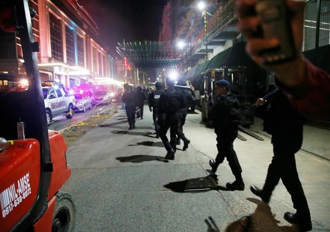 The Latest: Thick smoke had trapped dead in gambling space | iNFOnews.ca