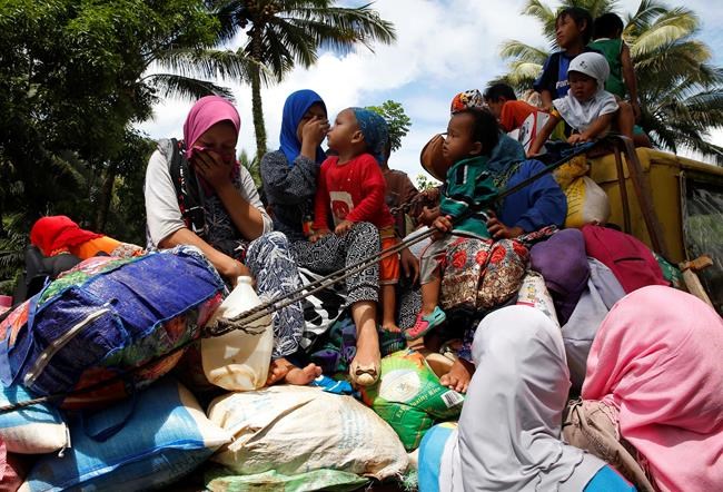 The Latest: Philippine military says foreign fighters killed | iNFOnews.ca