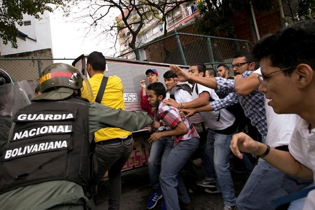 The Latest: Venezuela troops block protesters | iNFOnews.ca