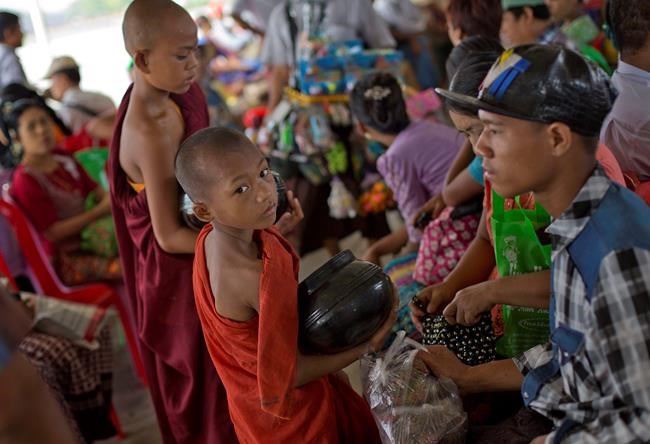 Image of Asia: Collecting alms from ferry riders in Myanmar | iNFOnews.ca Image of Asia: Collecting alms from ferry riders in Myanmar | iNFOnews.ca