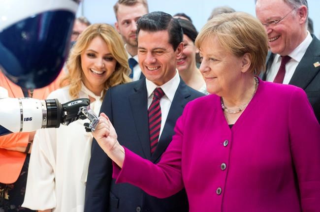 EU trade chief says Merkel, Macron will push Trump on steel | iNFOnews.ca CP585600836