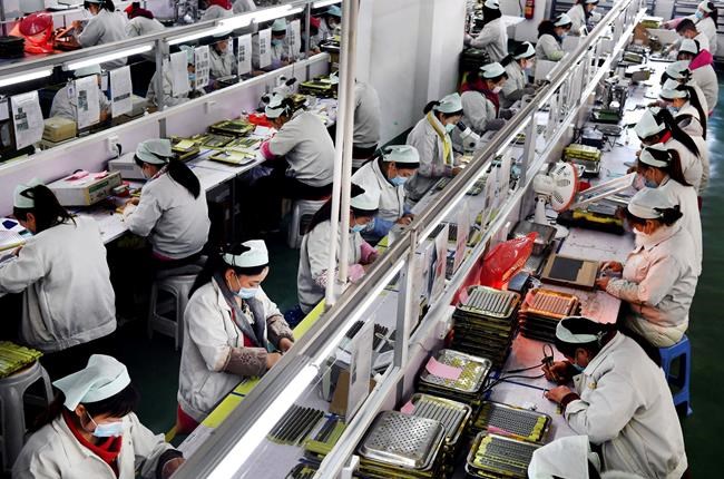 China's factories try to shield workers as output revives | iNFOnews.ca China's factories try to shield workers as output revives | iNFOnews.ca