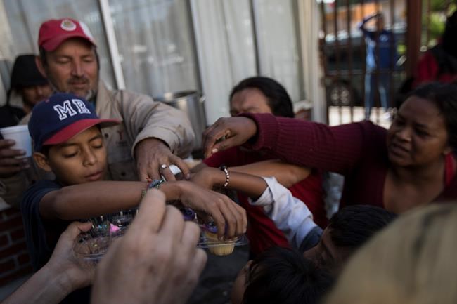 The Latest: US may tell asylum-seekers to wait in Mexico | iNFOnews.ca