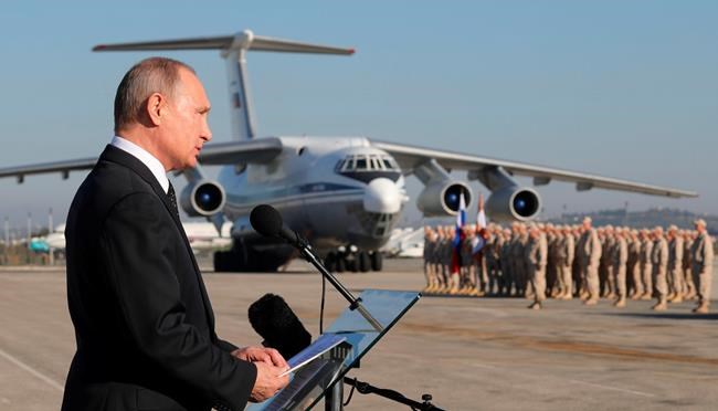Putin declares victory on visit to air base in Syria | iNFOnews.ca CP2041680265