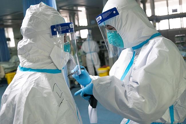 China expands lockdown against virus, fast-tracks hospital | iNFOnews.ca CP575707356