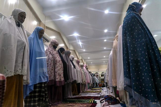 In Aceh, Indonesians pray at mosque but bring their own rugs | iNFOnews.ca