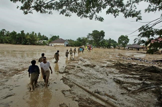 Rescuers looking for 23 missing in deadly Indonesia floods | iNFOnews.ca
