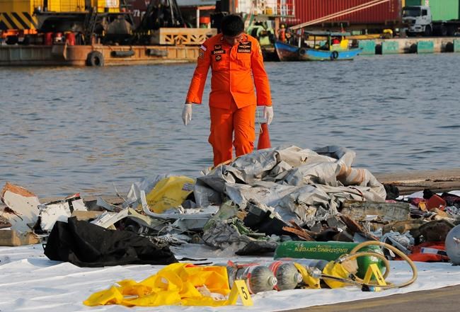The Latest: Searchers recover remains, debris | iNFOnews.ca