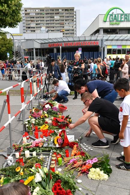 After Munich shooting, tearful witnesses linger at scene | iNFOnews.ca