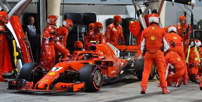Vettel wins Bahrain, Raikkonen's car breaks mechanic's leg | iNFOnews.ca Vettel wins Bahrain, Raikkonen's car breaks mechanic's leg | iNFOnews.ca