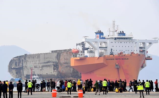 Raised South Korean ferry Sewol arrives at port for search | iNFOnews.ca