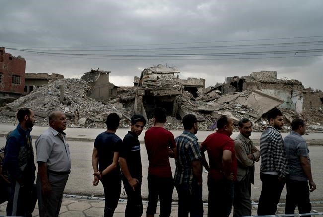 The Latest: Iraq's election commissioner says turnout 44 pct | iNFOnews.ca The Latest: Iraq's election commissioner says turnout 44 pct | iNFOnews.ca