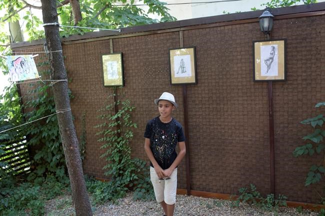 Afghan boy known as 'Little Picasso' shows works in Serbia | iNFOnews.ca