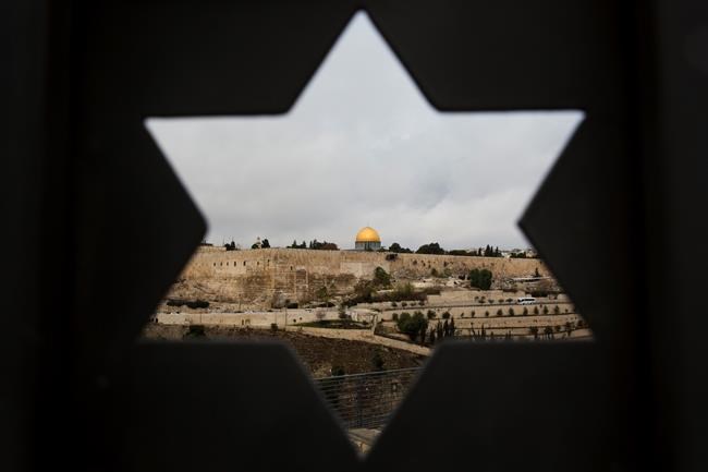 The Latest: Palestinians in Gaza burn US, Israel flags | iNFOnews.ca CP1653056915