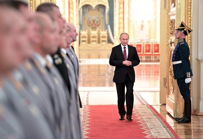 Putin takes part in Russian military drills, fires missiles | iNFOnews.ca