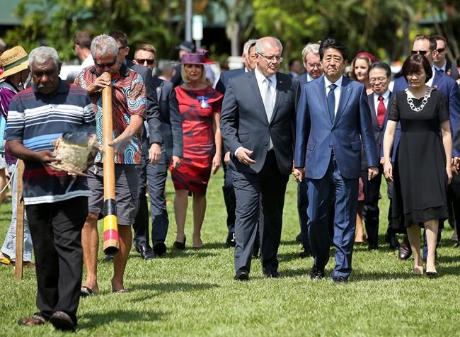 Japan's Abe lays wreath in Australia city bombed in WWII | iNFOnews.ca