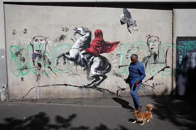 Street artist Banksy splashes Paris with works on migrants | iNFOnews.ca