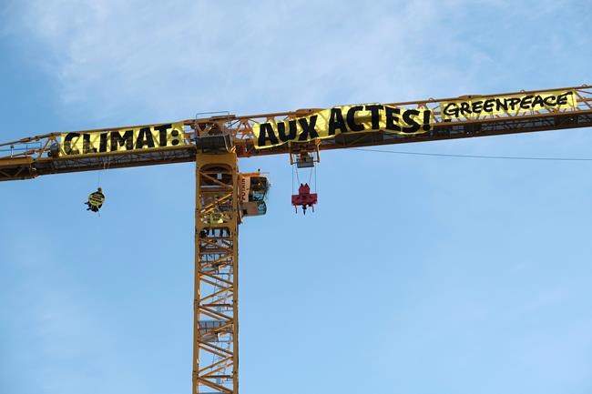 Climate activists protest from Notre Dame Cathedral crane | iNFOnews.ca