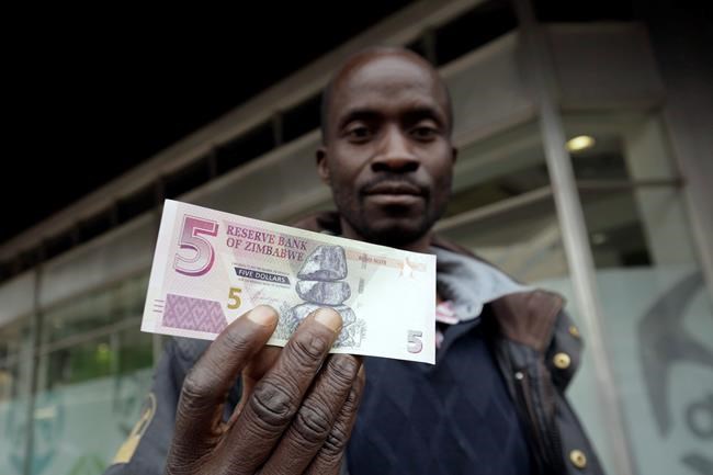 Zimbabwe president praises re-introduction of local currency | iNFOnews.ca CP454856957