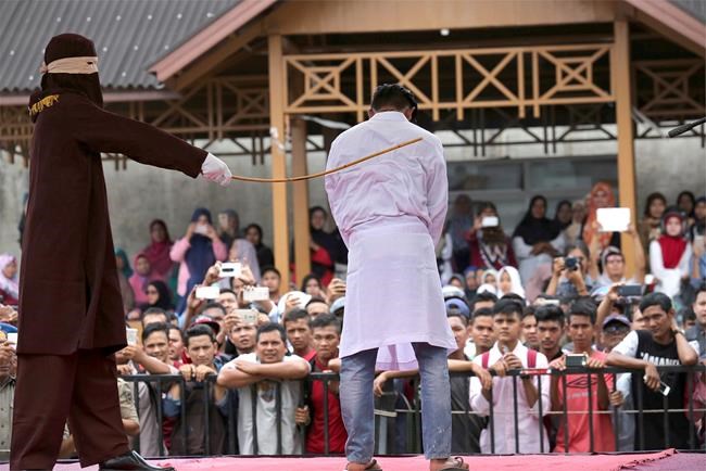 2 men in Indonesia's Aceh province face caning for gay sex | iNFOnews.ca CP239226232