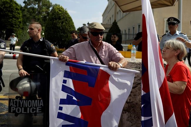 Greek anti-austerity protesters pelt police with fish | iNFOnews.ca Greek anti-austerity protesters pelt police with fish | iNFOnews.ca