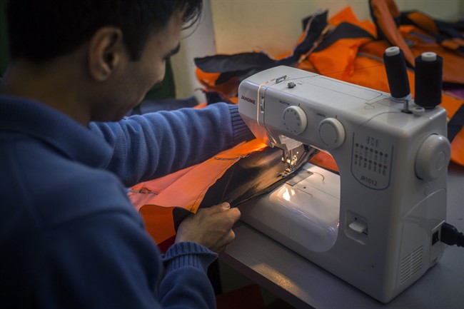 From symbol of despair to fashion: Volunteers, refugees in Greece turn life vests into handbags | iNFOnews.ca CP35938168