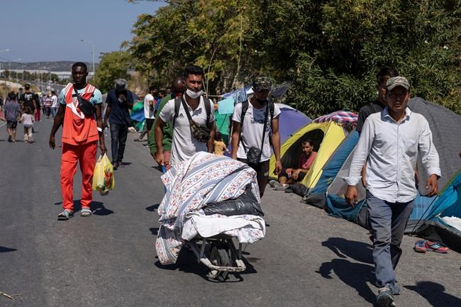 Thousands protest after Greek refugee camp burns down | iNFOnews.ca
