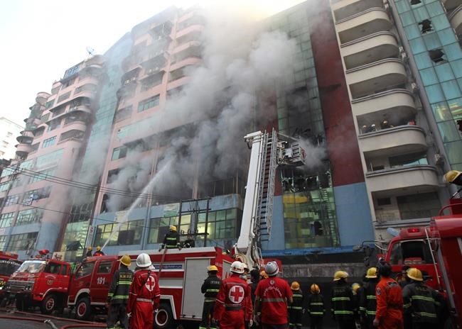 Myanmar firefighters extinguish blaze at high-rise in Yangon | iNFOnews.ca Myanmar firefighters extinguish blaze at high-rise in Yangon | iNFOnews.ca