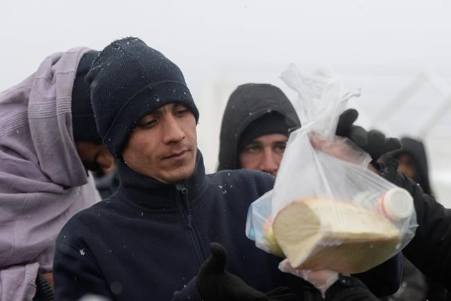 Migrants in burnt Bosnia camp wait for new tents in blizzard | iNFOnews.ca Migrants in burnt Bosnia camp wait for new tents in blizzard | iNFOnews.ca