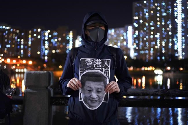 Hong Kong protesters mock China leaders, defy face mask ban | iNFOnews.ca Hong Kong protesters mock China leaders, defy face mask ban | iNFOnews.ca