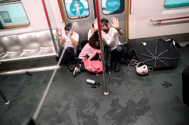 The Latest: Hong Kong police storm subway car with batons | iNFOnews.ca CP1742980370
