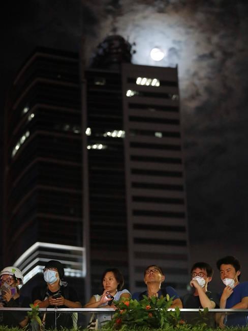 Police keep low profile at huge, peaceful Hong Kong protest | iNFOnews.ca