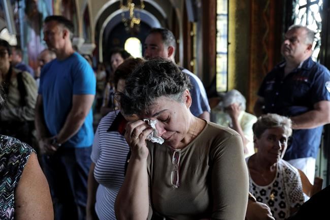 The Latest: Candlelight vigil held for victims of Greek fire | iNFOnews.ca