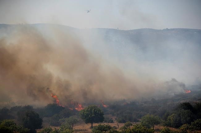 Tourists evacuated from Greek island camp as wildfire rages | iNFOnews.ca