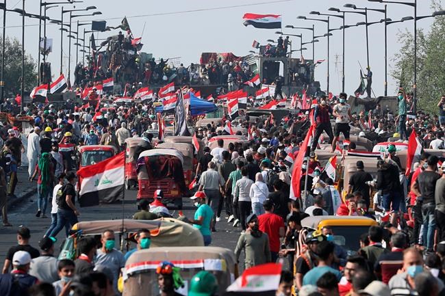 In nod to protests, Iraq president calls for new voting law | iNFOnews.ca