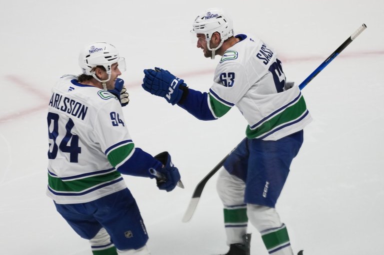 Boeser has hat trick, last-place Canucks overcome blowing 4-goal lead to beat NHL-leading Avs 8-6 | iNFOnews.ca