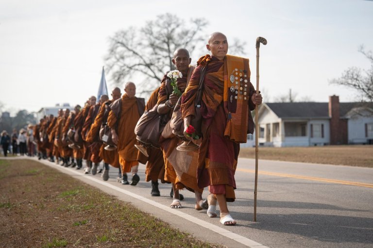 Photos of monks and rescue dog as they finish cross-country peace walk in Washington, DC | iNFOnews.ca