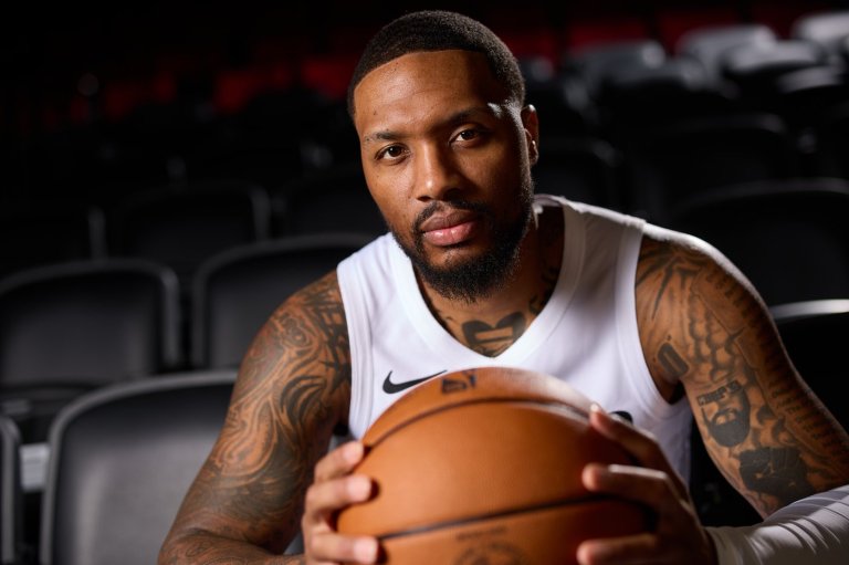 Not currently playing and not a coach, Damian Lillard has a unique role with the Blazers | iNFOnews.ca