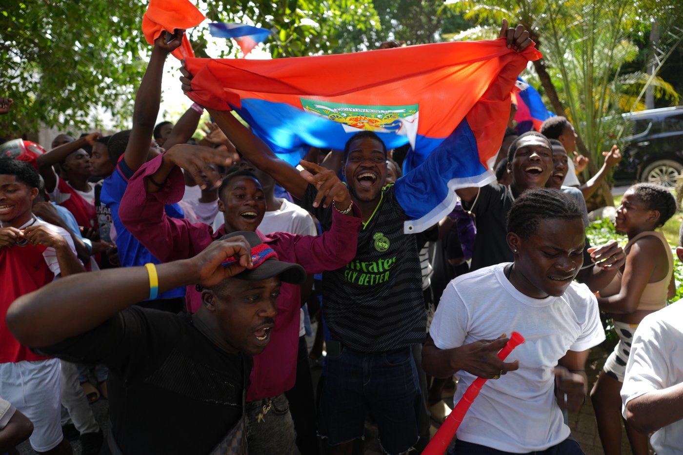 Members of Haiti's national soccer team tour their capital after playing in the World Cup | iNFOnews.ca