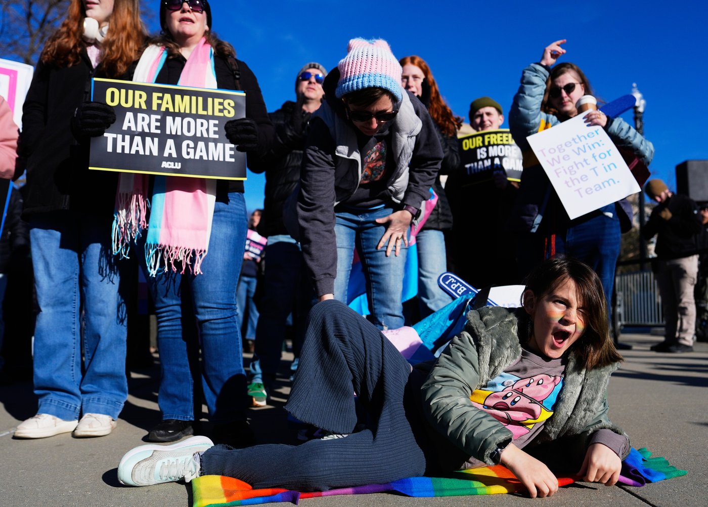 Photos of demonstrators outside the Supreme Court as it considers upholding transgender sports bans | iNFOnews.ca