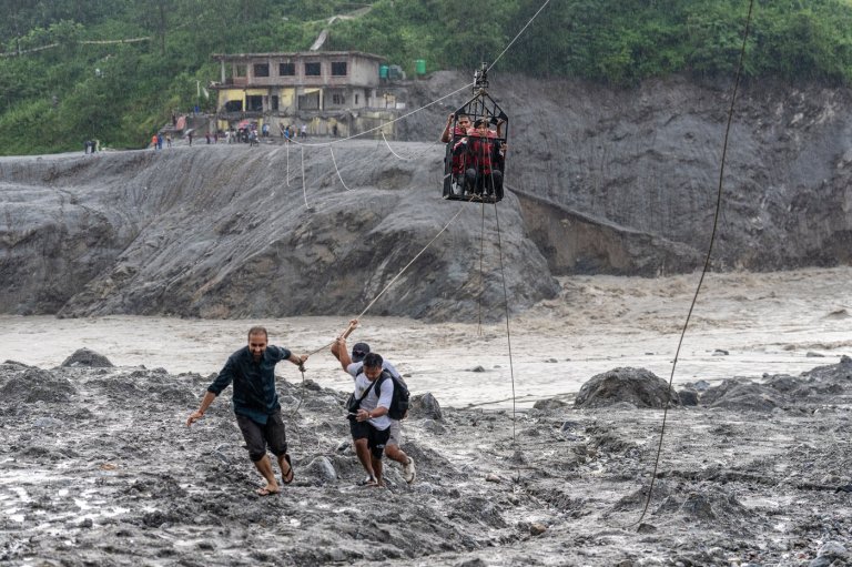 Trading food for medicine and crossing the river by zip line are part of life in Nepal flood zone | iNFOnews.ca