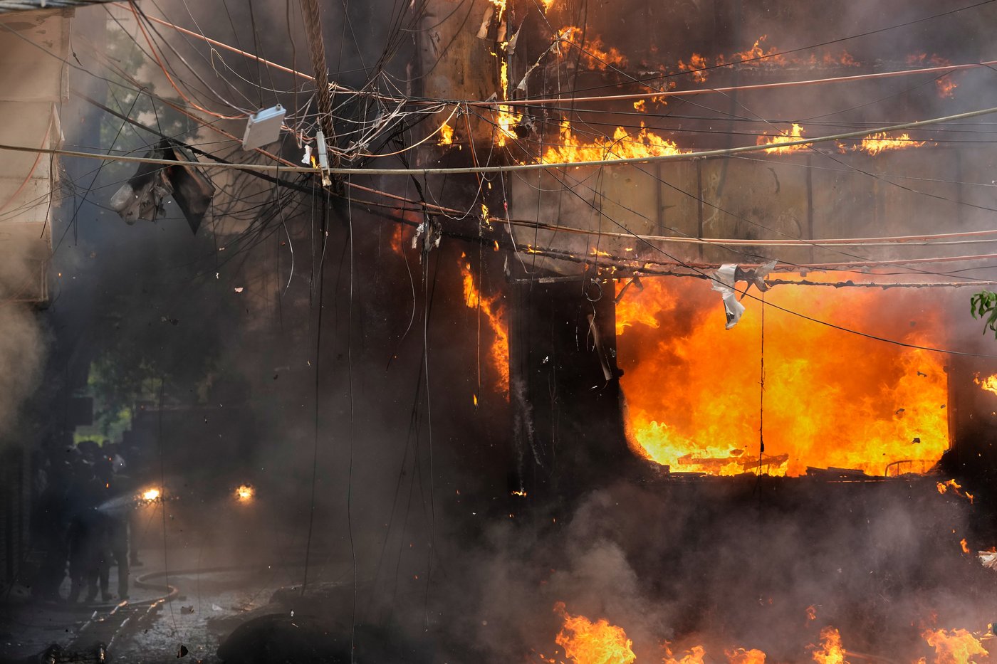 Photos show rescue efforts and aftermath of New Delhi building fire | iNFOnews.ca