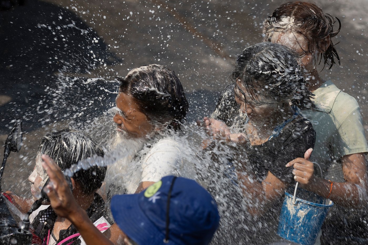 People spray water to celebrate the Thai New Year during the Songkran festival, in photos | iNFOnews.ca