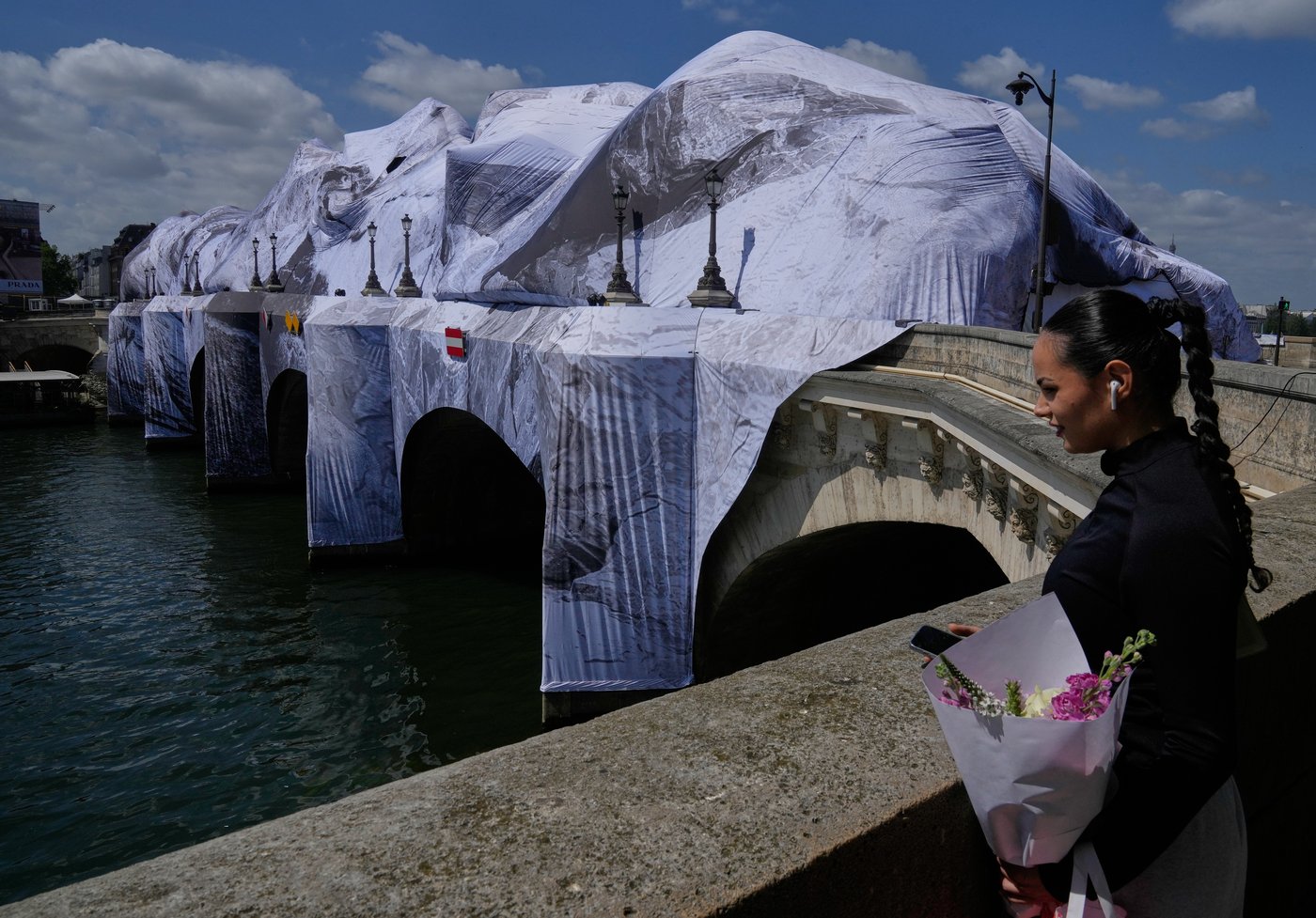 Artist JR, the 'French Banksy' creates a 'cave' installation over Paris' oldest bridge | iNFOnews.ca Artist JR, the 'French Banksy' creates a 'cave' installation over Paris' oldest bridge | iNFOnews.ca