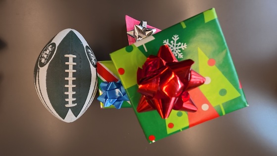 A football and some wrapped gifts.