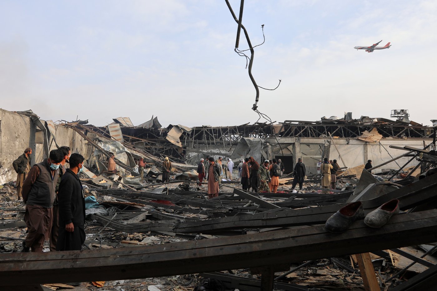 Rescue crews race through rubble after a deadly Kabul airstrike, in photos | iNFOnews.ca