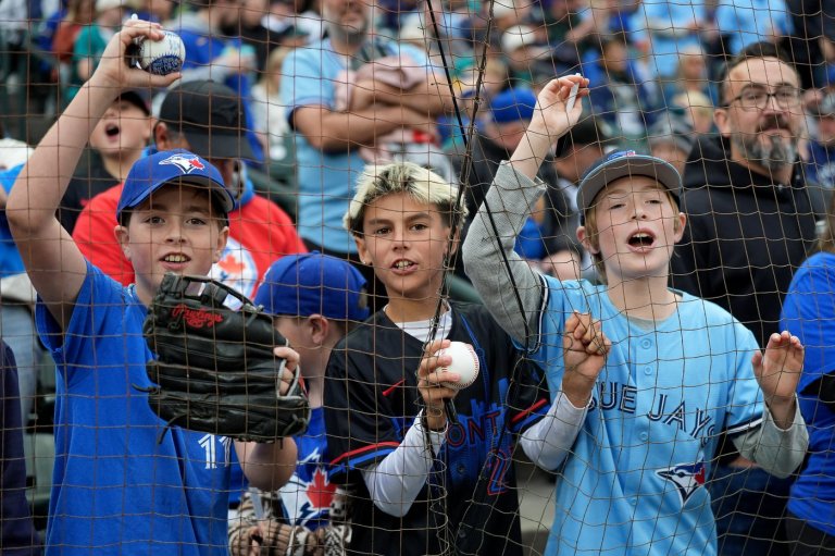 Parents weigh cost of later school night bedtime to cheer the Blue Jays as a family | iNFOnews.ca