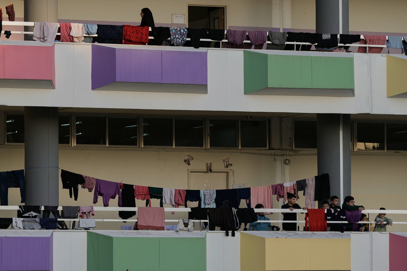 Photos of displaced civilians in Lebanon, where schools and stadiums turn into shelters during war | iNFOnews.ca