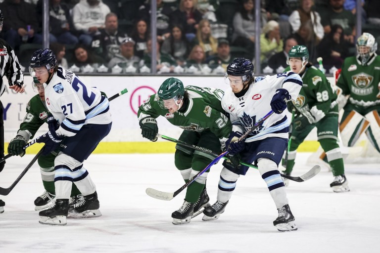 Hockey players play hockey.